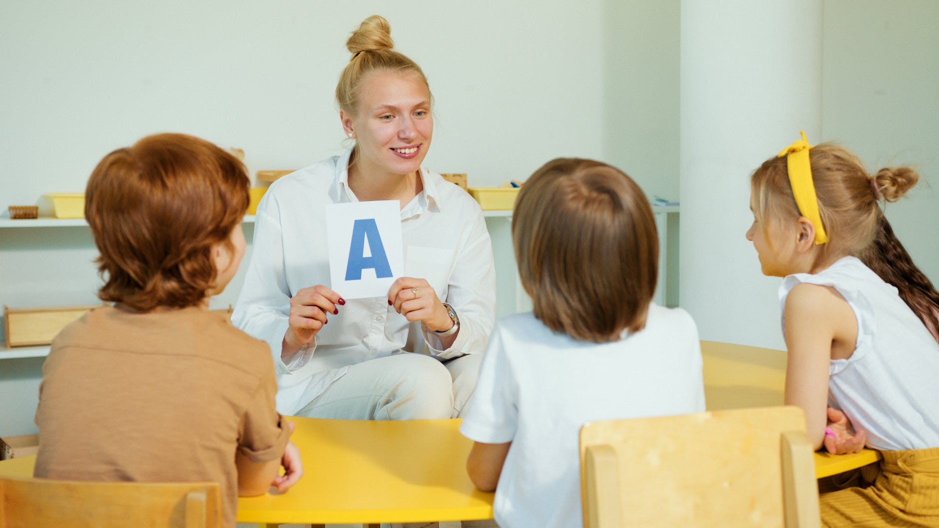 a woman teaching a children