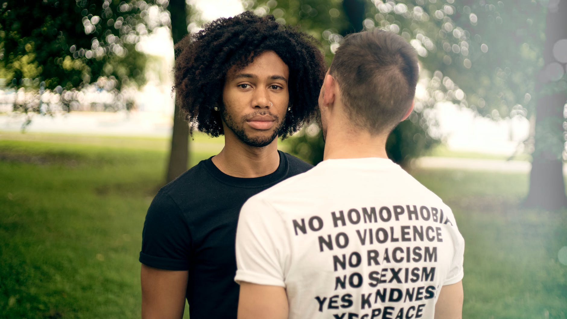 man facing man with black shirt